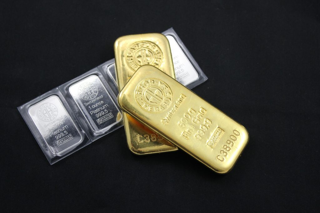 Gold and platinum bullion bars representing How to buy gold IRA, are gold IRAs safe, investing in gold, IRA in gold, and alternative IRA investments for retirement diversification.