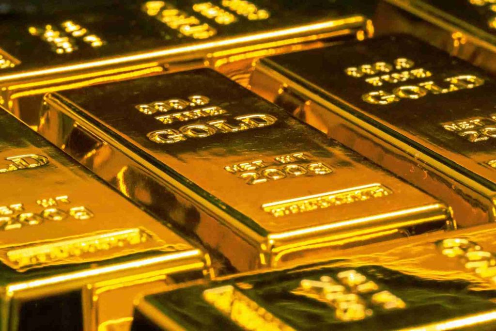 Close-up of stacked gold bullion bars representing Gold backed IRA, gold IRA plans, gold star IRA, gold IRA custodian reviews, and gold IRA reviews for retirement investors exploring precious metals.